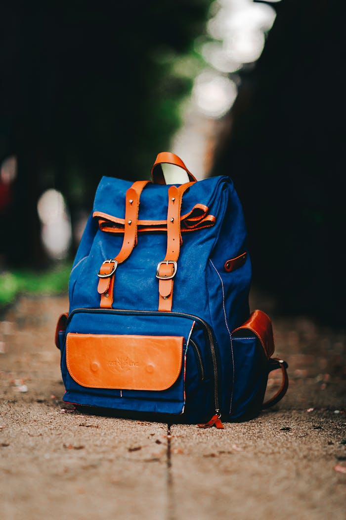 Blue and Brown Backpack  on the Ground